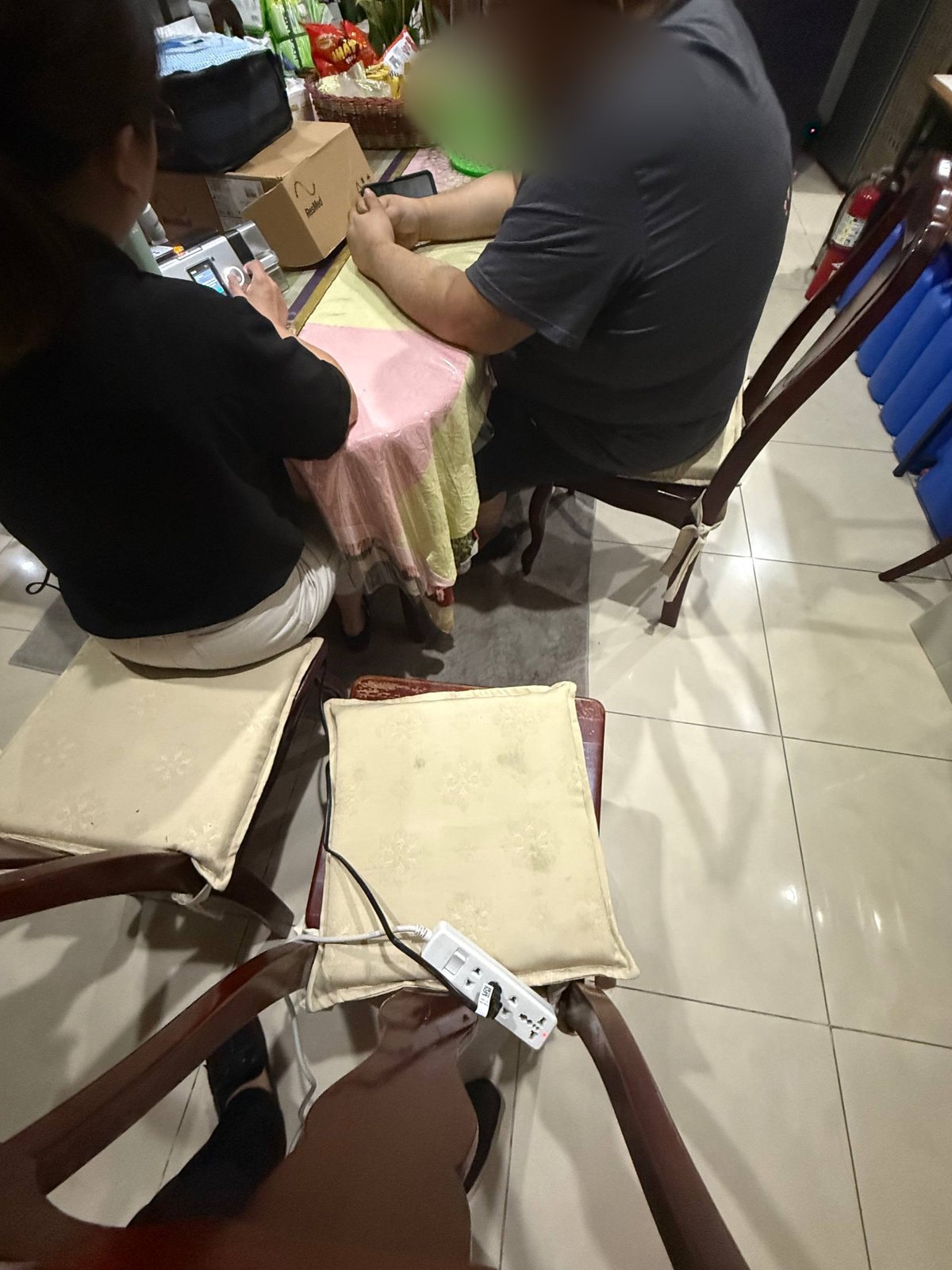 The respiratory therapist and the patient going over the machine at the table